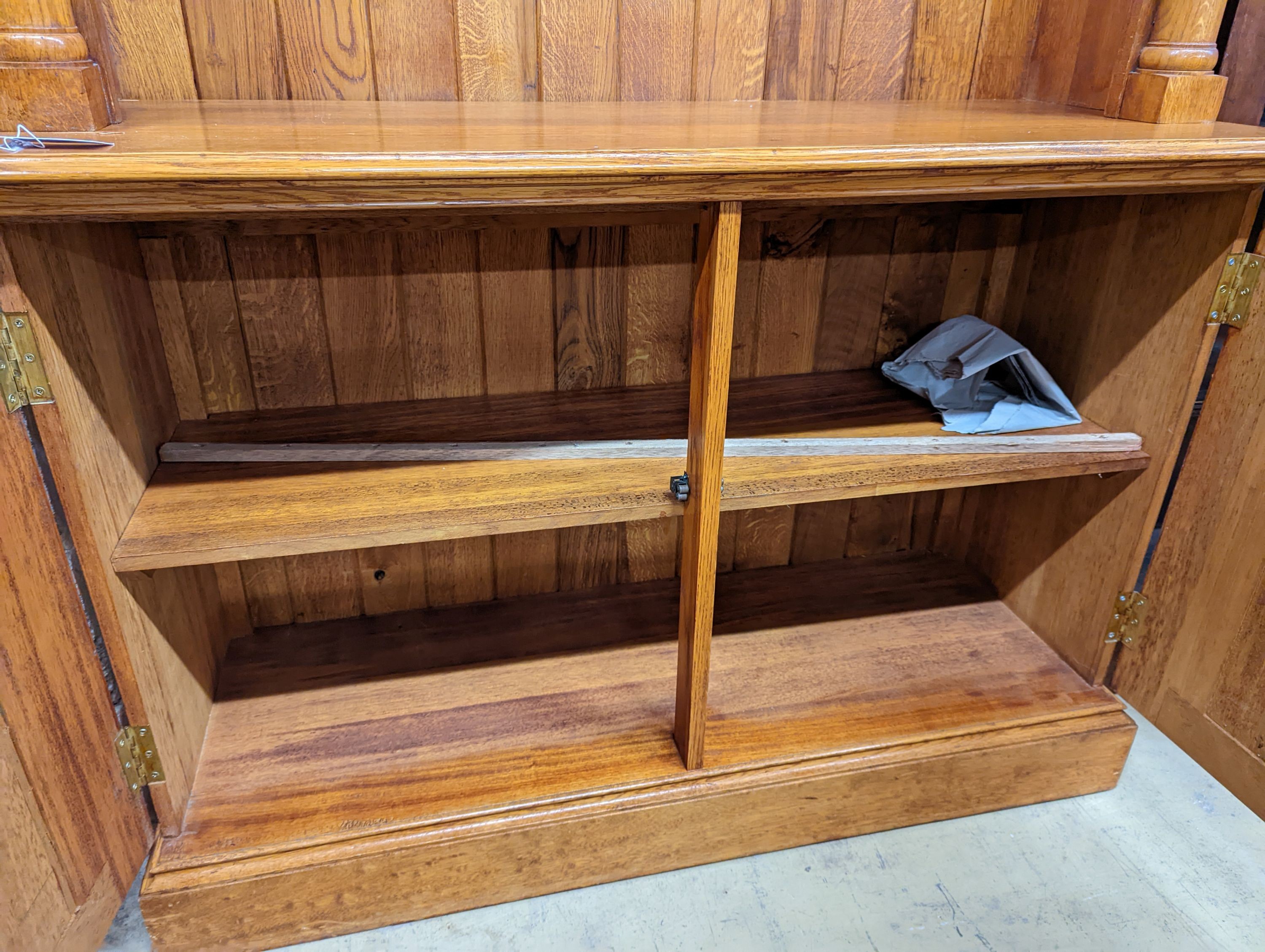 A Victorian style pale oak open bookcase, length 122cm, depth 46cm, height 229cm